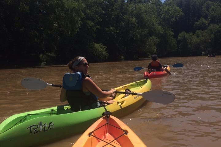 a group of people on a boat in the water