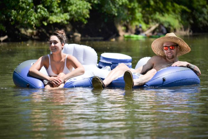 a young man riding a surfboard in the water