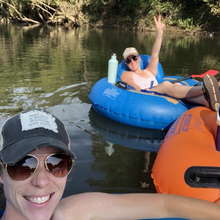 a woman sitting on a boat in the water