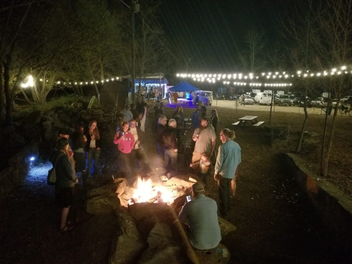 a group of people that are standing in the dark