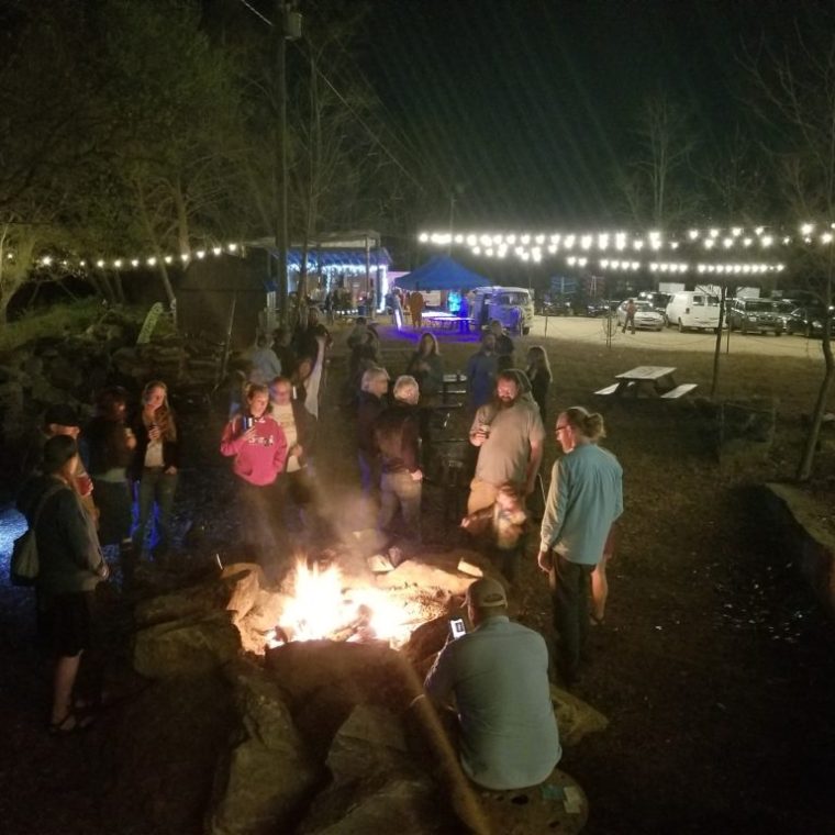 a group of people that are standing in the dark
