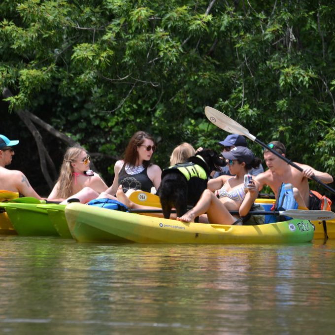 a group of people riding on the back of a boat