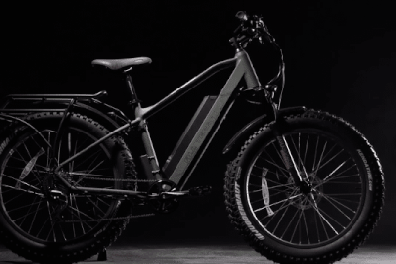 a bicycle leaning against a wall